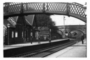 Baildon Station with 2 lines, a footbridge and a steam loco arriving