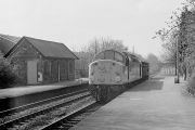 A Class 40 loco at Baildon station. Mid 1970s? Both platforms in use. No footbridge. Wooden steps on opposite platform.